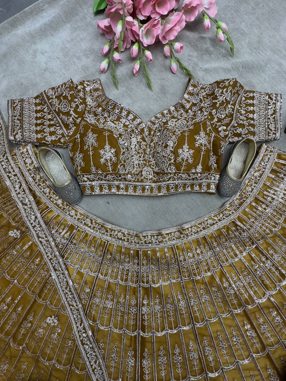 Rust Color Soft Net Sequence Work Lehenga Choli